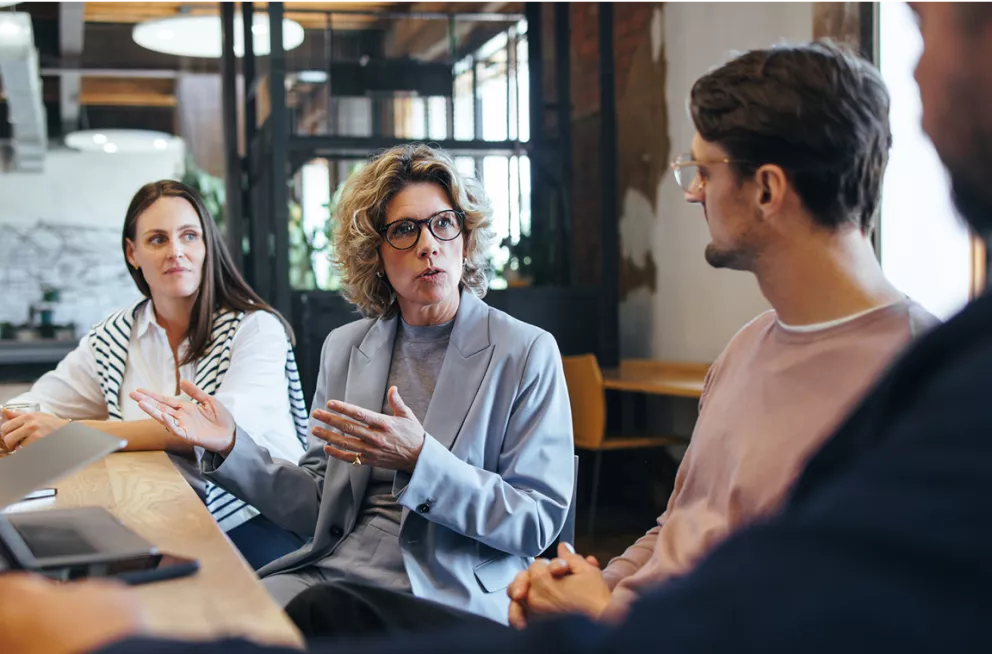 Group of colleagues in a work meeting setting